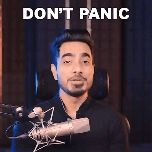 Man At Microphone Saying Don't Panic GIF
