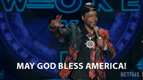 Man at Microphone Saying May God Bless America
