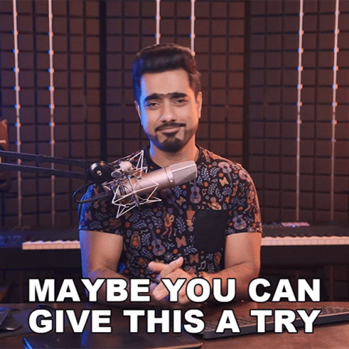 Man At Microphone Saying Maybe You Can Give This A Try GIF
