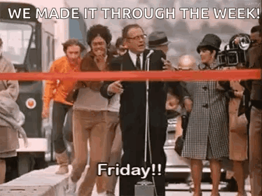 Man At Microphone Says We Made It Through The Week GIF