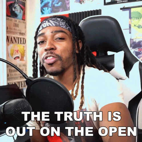 Man at Microphone The Truth Is Out on the Open