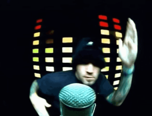 Man At Microphone Waving GIF