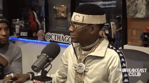 Man at Microphone With C Headband