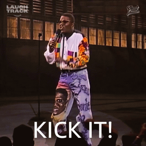 Man at Microphone With Kick It on Screen
