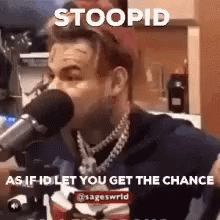 Man at Microphone With Stoopid Caption