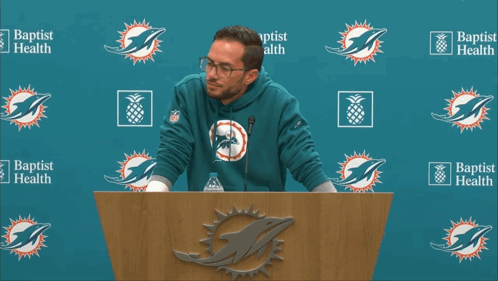 Man At Podium In Front Of Baptist Health GIF