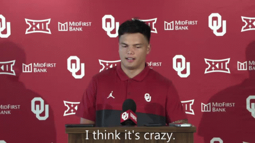 Man at Podium Saying I Think It's Crazy
