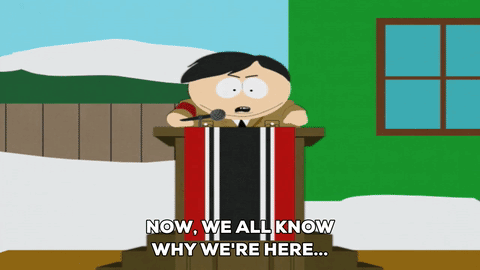 Man at Podium Saying Now We Know Why We Are Here