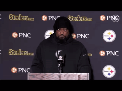 Man at Podium With Steelers.com and PNC Logos