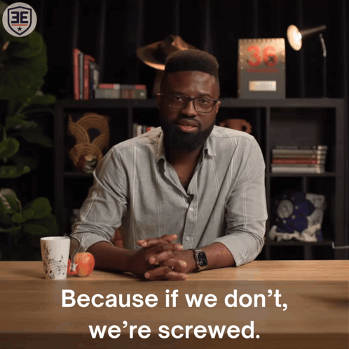 Man at Table Saying Because If We Don't We're Screwed