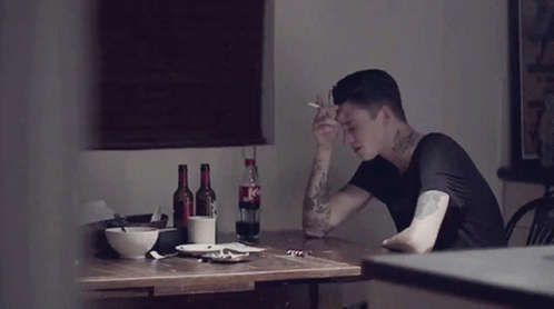 Man at Table With Coca Cola Bottle