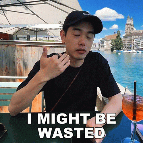 Man at Table With Drink Saying I Might Be Wasted