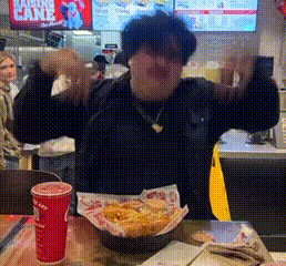 Man at Table With French Fries and Drink