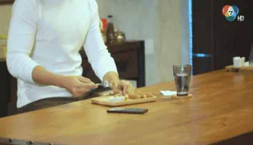 Man at Table with Glass of Water and Phone