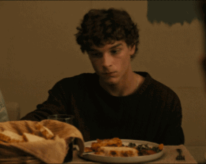 Man at Table with Plate of Food