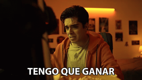Man at Table With Tengo Que Ganar