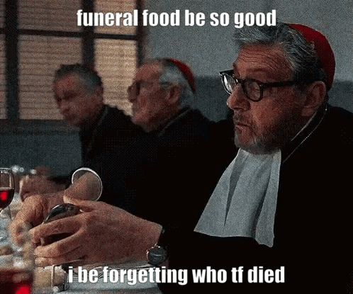 Man At Table With Wine Saying Funeral Food GIF