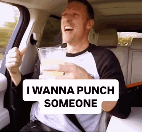 Man Back Seat Holding Drink Saying I Wanna Punch Someone