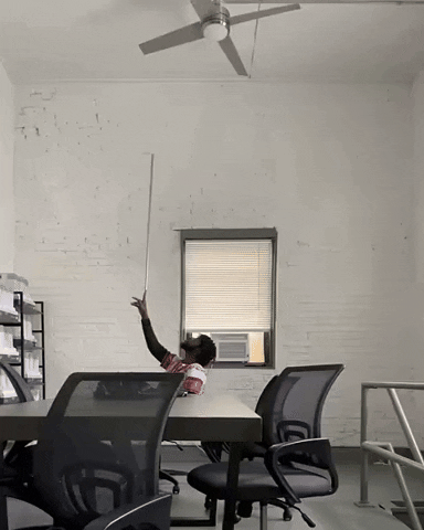 Man Balance Long Stick On Index Finger GIF