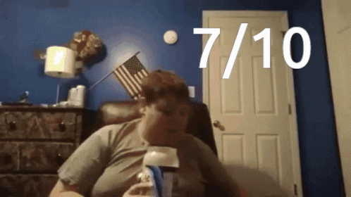 Man Before Blue Wall With 7 And 10 GIF