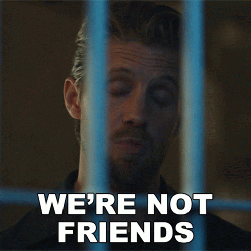 Man Behind Bars Saying We're Not Friends