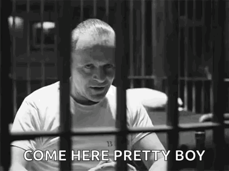 Man Behind Bars Talking GIF