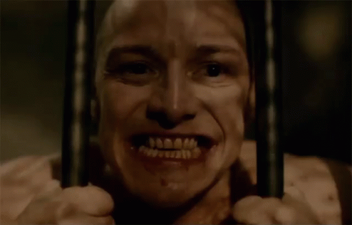 Man Behind Bars with Open Mouth