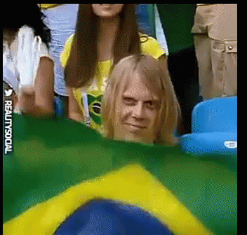 Man Behind Brazilian Flag