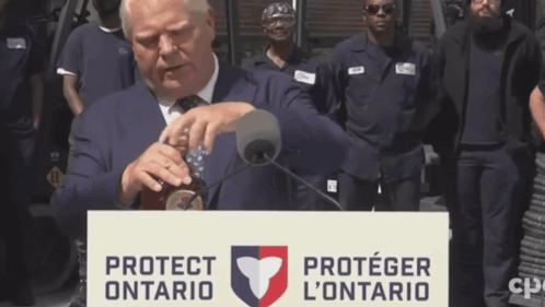 Man Behind Podium Protect Ontario