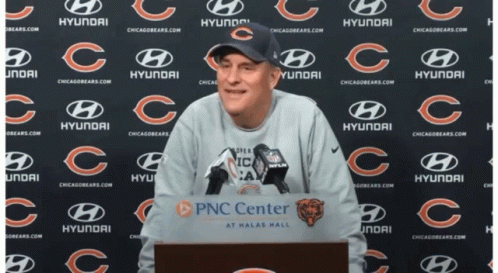 Man Behind Podium Saying PNC Center