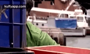Man Behind The Containers Hiding Meme GIF