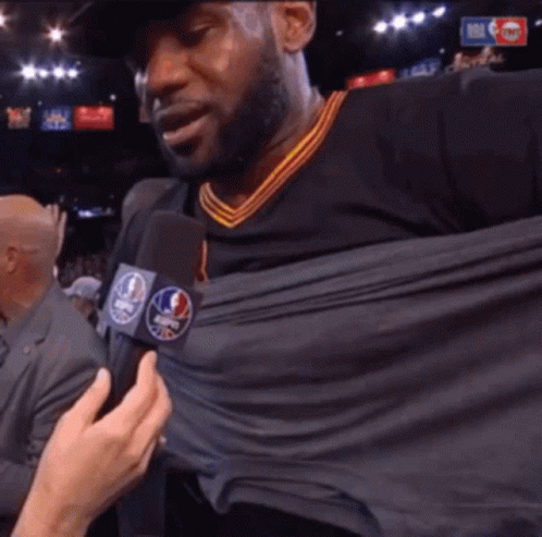 Man Being Interviewed with NBA Logo Microphone