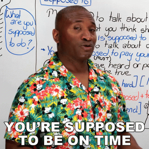 Man Beside White Board Saying You're Supposed to Be on Time