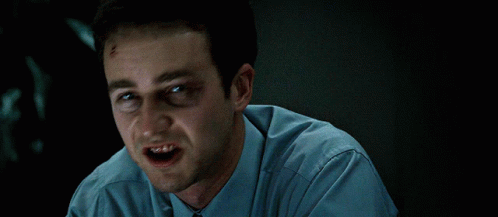 Man Black Eye Blue Shirt Making Face