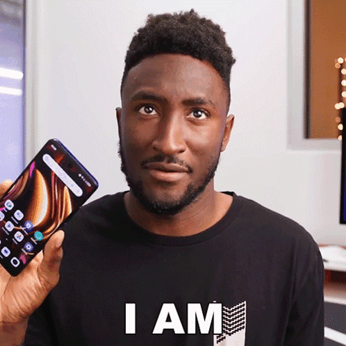 Man Black Shirt Holding Phone Saying I Am GIF