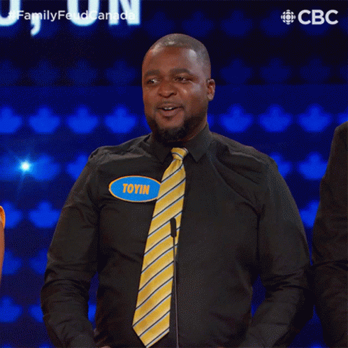 Man Black Shirt Yellow Tie Potin Name Tag