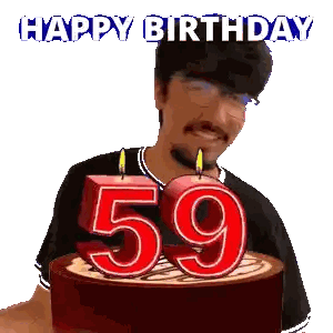 Man Blowing Out 59th Birthday Candles