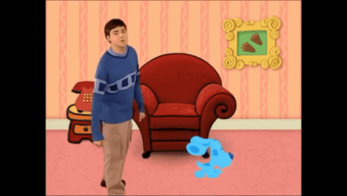 Man Blue Sweater Beside Red Chair Blue Dog