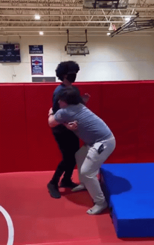 Man Body Slam Woman On A Mattress GIF