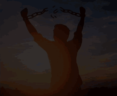 Man Breaking Chains Silhouette