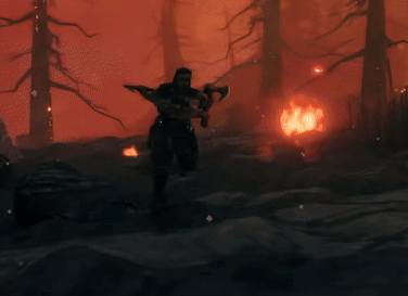Man by Fire in Forest