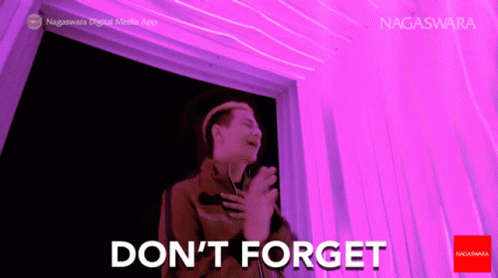 Man By Purple Wall Saying Don't Forget GIF