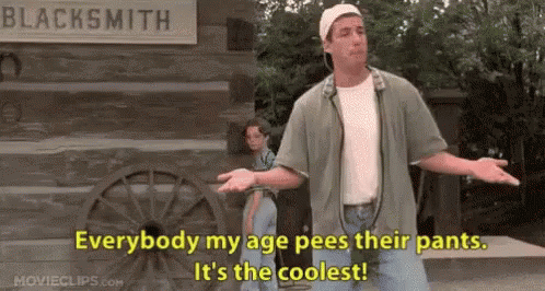 Man by Sign Everybody My Age Pees Their Pants
