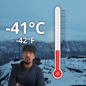 Man By Snowy Mountain With Thermometer 41 Degrees GIF