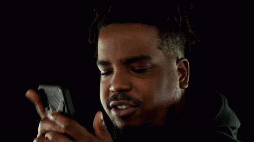 Man Carefully Reading Phone Text Message GIF