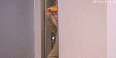 Man Carrying Bag Wearing Hook Em Cap GIF