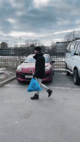 Man Carrying Blue Bag Walking