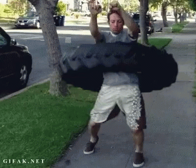 Man Carrying Large Black Bag