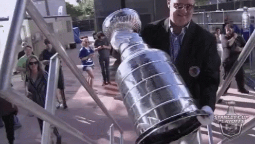 Man Carrying Stanley Cup To The Stage GIF