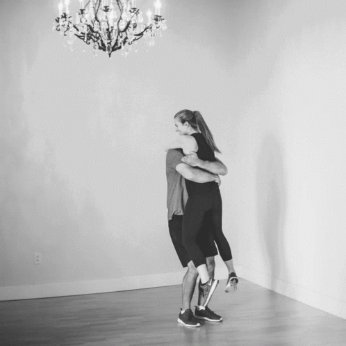 Man Carrying Woman In Arms GIF
